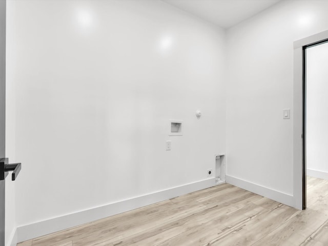 310 Harborview Dr, Rockwall, TX 75032 - laundry room with electric dryer hookup, washer hookup, light wood-type flooring, and baseboards