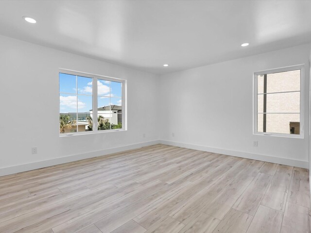 310 Harborview Dr, Rockwall, TX 75032 - unfurnished room with recessed lighting, light wood finished floors, and baseboards