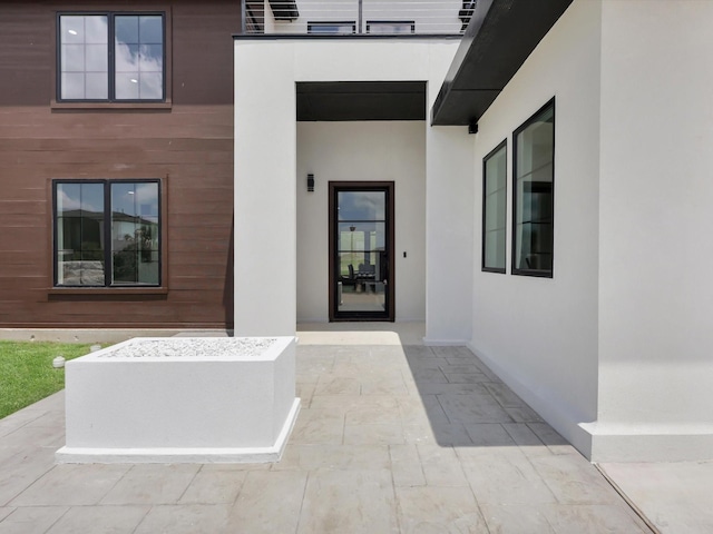 310 Harborview Dr, Rockwall, TX 75032 - property entrance with a patio area and stucco siding