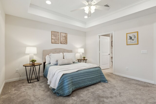 carpeted bedroom featuring baseboards, recessed lighting, a ceiling fan, crown molding, and a raised ceiling