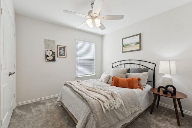 carpeted bedroom featuring baseboards and a ceiling fan