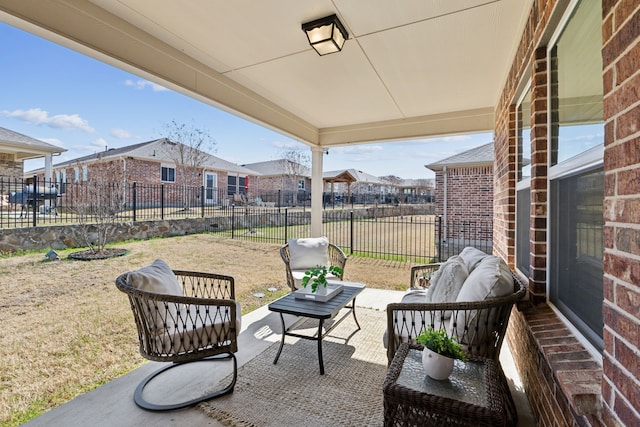 view of patio featuring a fenced backyard and a residential view