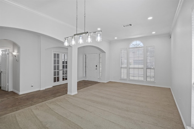 1124 Ginger Trl, Desoto, TX 75115 - unfurnished dining area featuring visible vents, arched walkways, crown molding, and carpet flooring