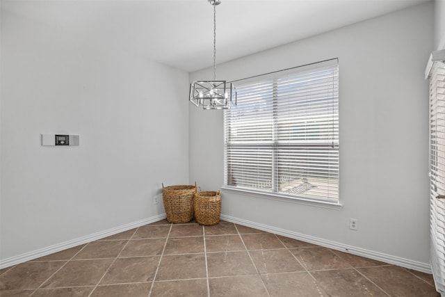 1124 Ginger Trl, Desoto, TX 75115 - interior space with tile patterned floors, baseboards, and a notable chandelier