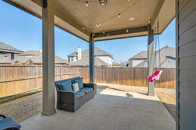 view of patio / terrace with a residential view and a fenced backyard