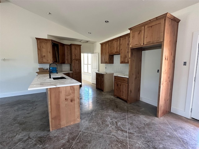 TBD5 Cowley Rd, Whitt, TX 76486 - kitchen featuring lofted ceiling, backsplash, and brown cabinets