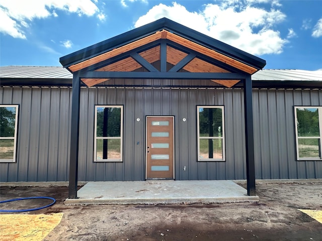 TBD5 Cowley Rd, Whitt, TX 76486 - property entrance with board and batten siding and a metal roof