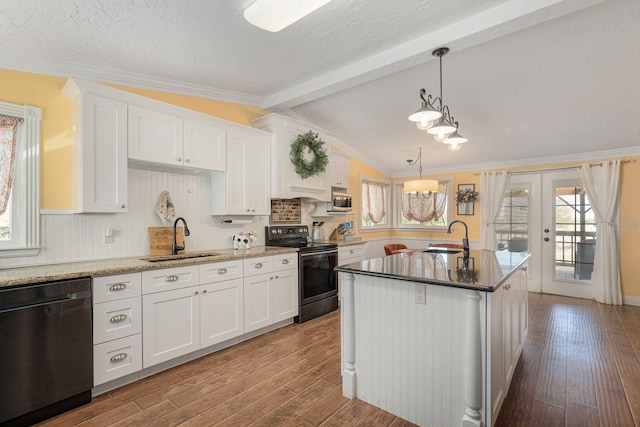 kitchen with dark wood-style flooring, appliances with stainless steel finishes, and a sink