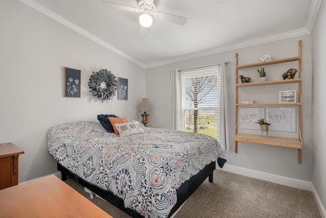 carpeted bedroom featuring ceiling fan, baseboards, and ornamental molding