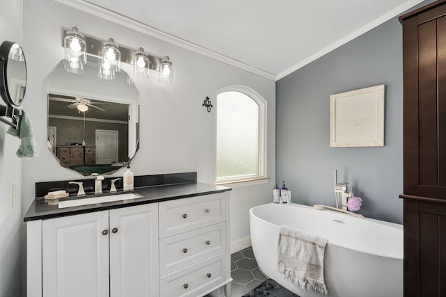 bathroom with vanity, crown molding, a ceiling fan, and a freestanding tub