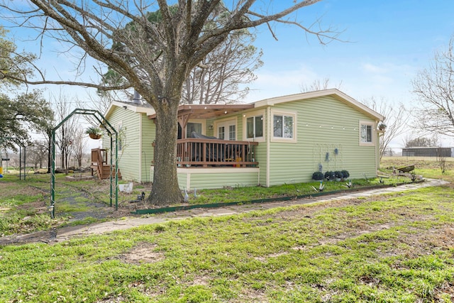 rear view of property with fence