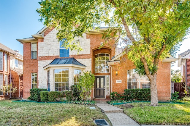 9005 Crown Point Cir, Irving, TX 75063 - traditional-style home with a front lawn, brick siding, and stone siding