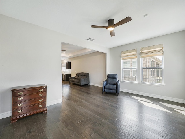 1722 Port Royal Ln, Frisco, TX 75036 - living area with dark wood-type flooring, ceiling fan, baseboards, and a raised ceiling