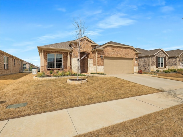 1722 Port Royal Ln, Frisco, TX 75036 - view of front of home with brick siding, a garage, driveway, and a front yard