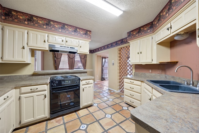 kitchen featuring a sink, under cabinet range hood, a textured ceiling, black range with electric cooktop, and light countertops