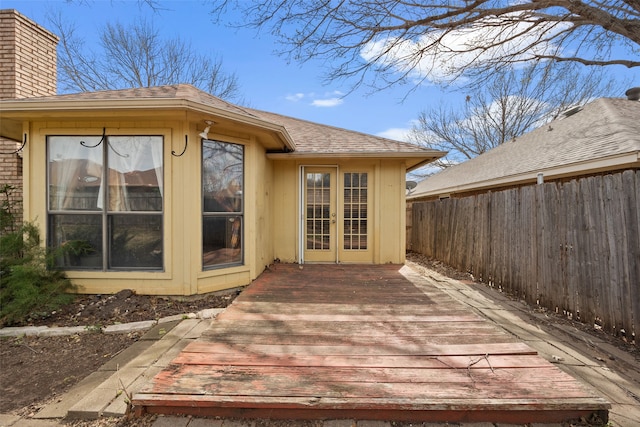 wooden deck with fence and french doors