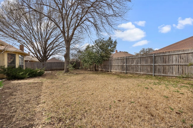 view of yard with a fenced backyard