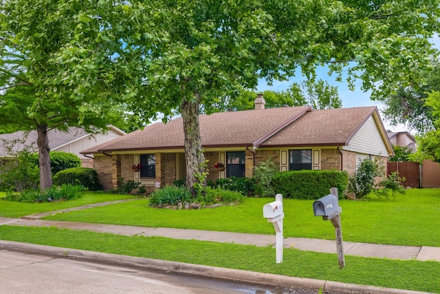 1318 Westpark Dr, Garland, TX 75040 - view of front of property with a chimney, brick siding, and roof with shingles