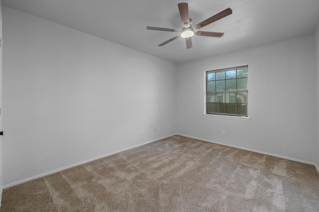 1318 Westpark Dr, Garland, TX 75040 - empty room with a ceiling fan, carpet floors, and baseboards