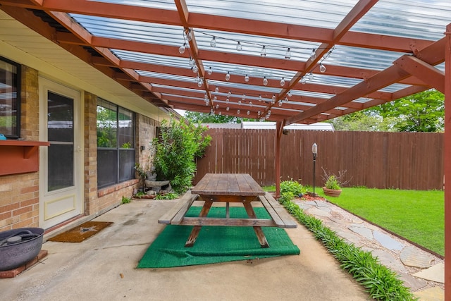 1318 Westpark Dr, Garland, TX 75040 - view of patio featuring a fenced backyard, a pergola, and outdoor dining area