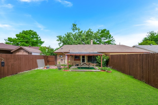 1318 Westpark Dr, Garland, TX 75040 - rear view of house featuring a patio