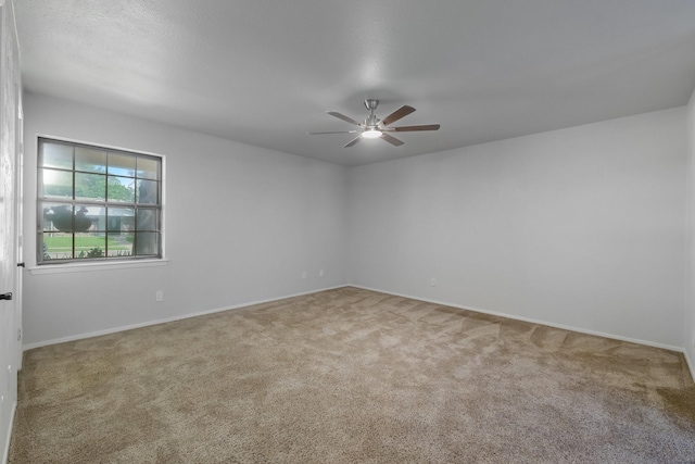1318 Westpark Dr, Garland, TX 75040 - carpeted spare room featuring ceiling fan and baseboards