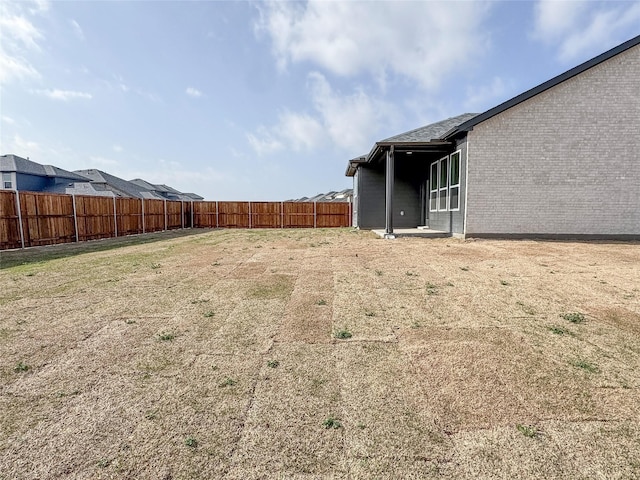 view of yard featuring a fenced backyard