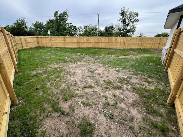 view of yard with a fenced backyard