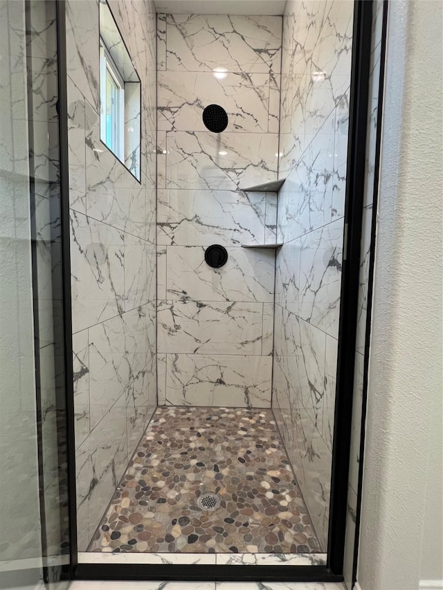 bathroom with a shower stall