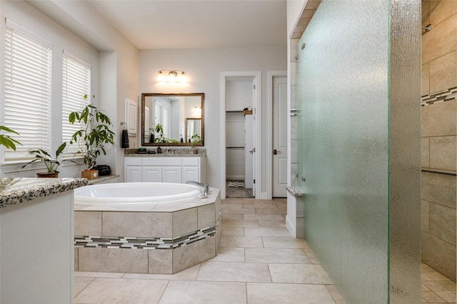 1628 Eleanor Dr, Fort Worth, TX 76052 - full bath featuring a tile shower, vanity, a bath, and tile patterned flooring