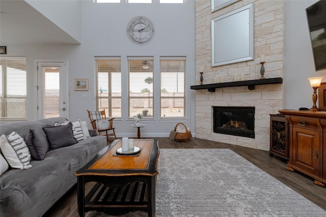 1628 Eleanor Dr, Fort Worth, TX 76052 - living area with dark wood finished floors, a fireplace, and baseboards