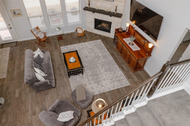 1628 Eleanor Dr, Fort Worth, TX 76052 - living area with baseboards, wood finished floors, stairs, and a fireplace