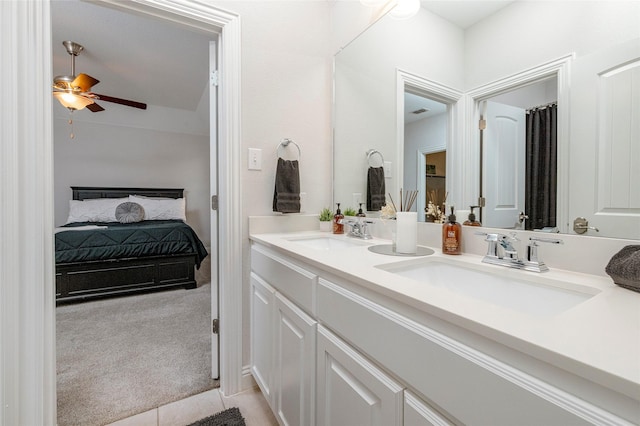 1628 Eleanor Dr, Fort Worth, TX 76052 - bathroom with double vanity, ensuite bath, a ceiling fan, and tile patterned flooring