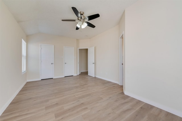 unfurnished bedroom with baseboards, light wood-style floors, ceiling fan, and a textured ceiling