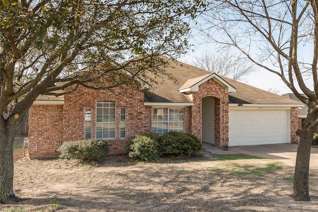 view of front of home with brick siding, an attached garage, concrete driveway, and a shingled roof