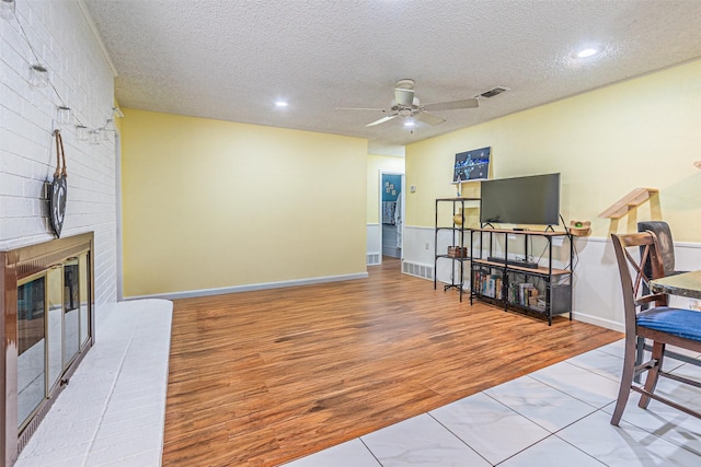 3805 Hastings Dr, Arlington, TX 76013 - living room featuring ceiling fan, wood finished floors, a textured ceiling, and recessed lighting
