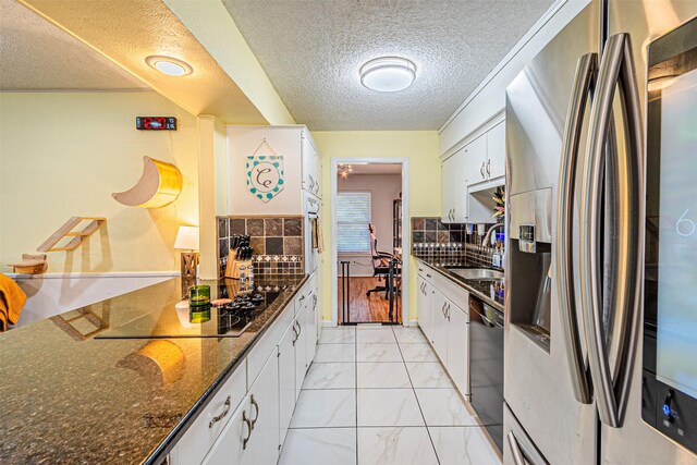 3805 Hastings Dr, Arlington, TX 76013 - kitchen featuring stainless steel refrigerator with ice dispenser, black electric stovetop, dishwashing machine, a textured ceiling, and light marble finish floors