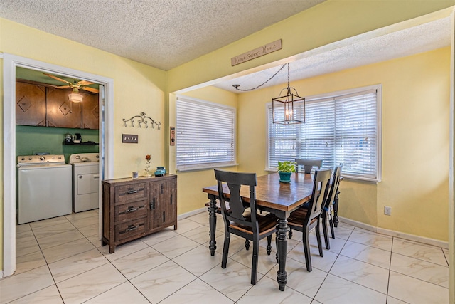 3805 Hastings Dr, Arlington, TX 76013 - dining space with separate washer and dryer, light marble finish floors, a chandelier, and a textured ceiling
