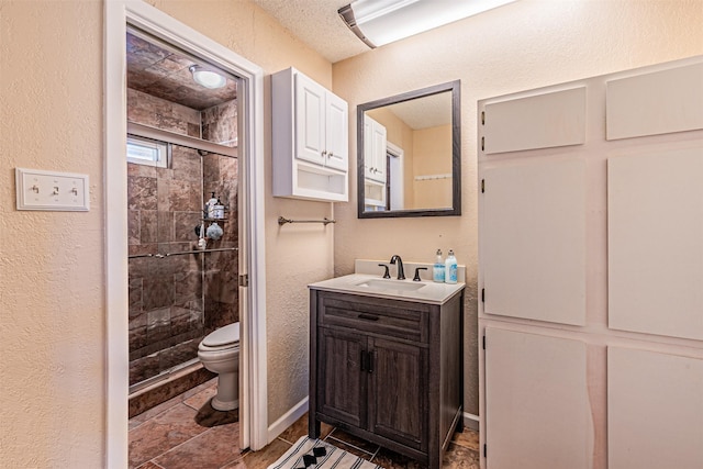3805 Hastings Dr, Arlington, TX 76013 - bathroom featuring a textured wall, a shower stall, and vanity