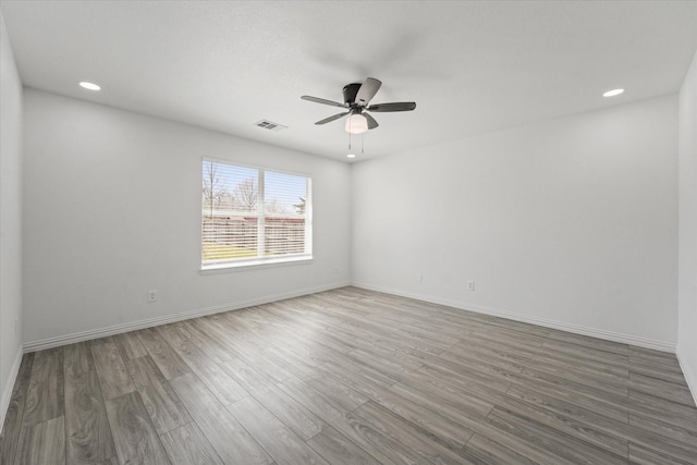 14514 Seagoville Rd, Dallas, TX 75253 - spare room featuring visible vents, ceiling fan, baseboards, and wood finished floors