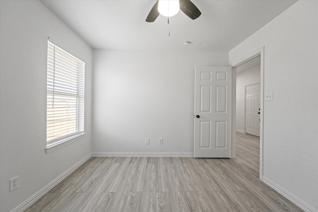 14514 Seagoville Rd, Dallas, TX 75253 - unfurnished room featuring light wood-style floors, baseboards, and a ceiling fan