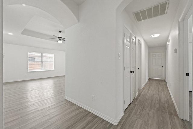 14514 Seagoville Rd, Dallas, TX 75253 - hallway with arched walkways, visible vents, baseboards, and wood finished floors
