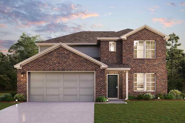 traditional-style house featuring brick siding, an attached garage, concrete driveway, and a front lawn