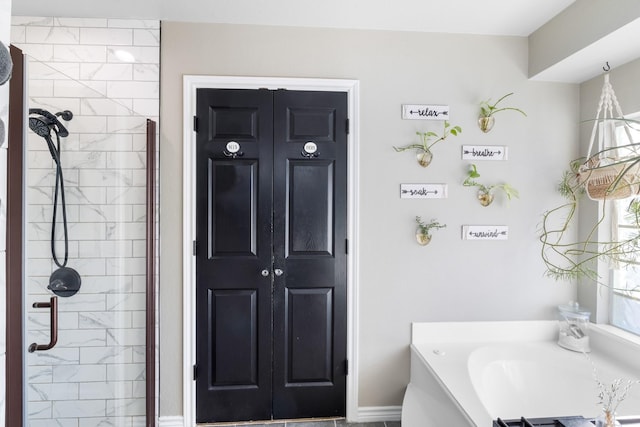 full bath featuring a bath and tiled shower