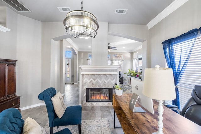 living room featuring visible vents, arched walkways, and ornamental molding