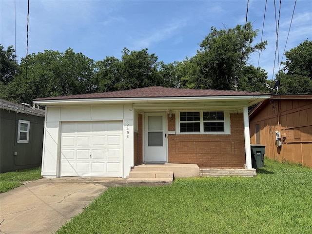 2608 N Hickory St, Sherman, TX 75092 - ranch-style house with driveway, brick siding, a front yard, an attached garage, and a shingled roof