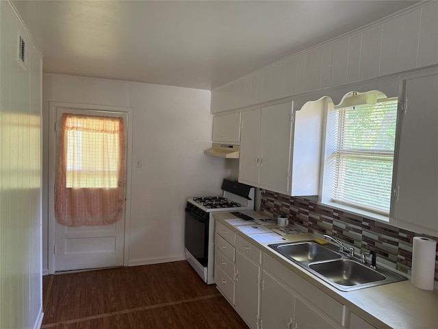 2608 N Hickory St, Sherman, TX 75092 - kitchen with white range with gas cooktop, under cabinet range hood, light countertops, white cabinets, and dark wood-style floors