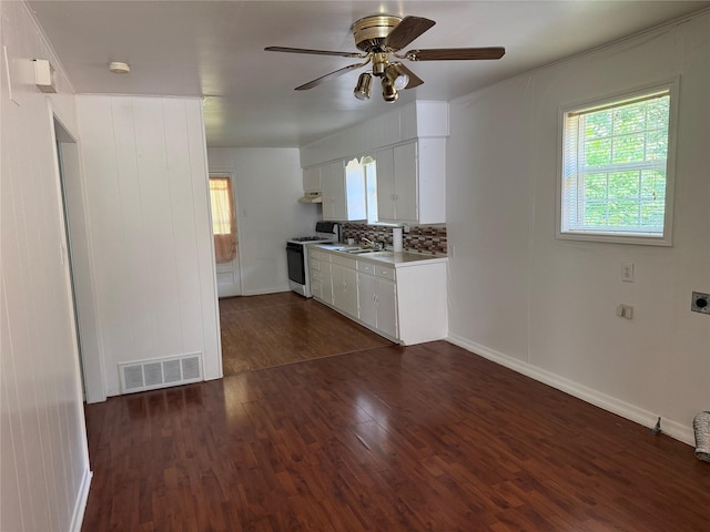 2608 N Hickory St, Sherman, TX 75092 - kitchen featuring gas range gas stove, a ceiling fan, dark wood-style flooring, and white cabinetry