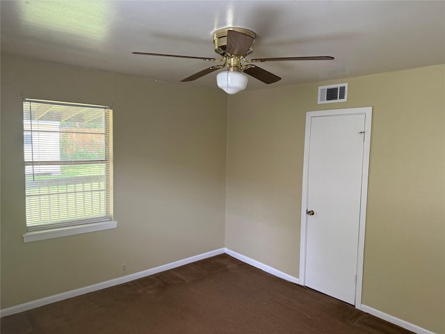 2608 N Hickory St, Sherman, TX 75092 - spare room with healthy amount of natural light, dark carpet, and a ceiling fan