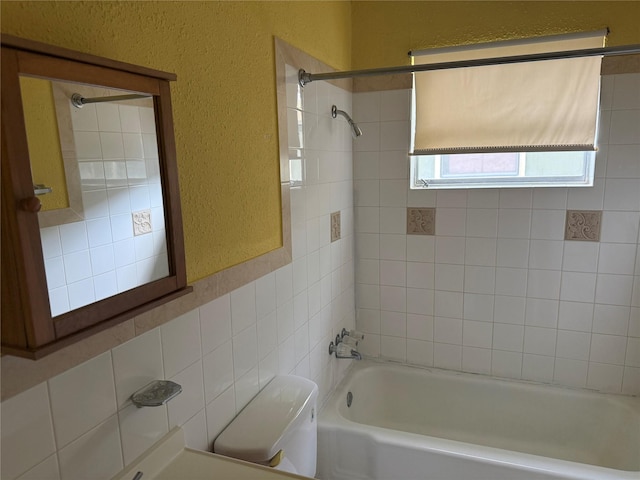 2608 N Hickory St, Sherman, TX 75092 - bathroom featuring bathtub / shower combination and a textured wall